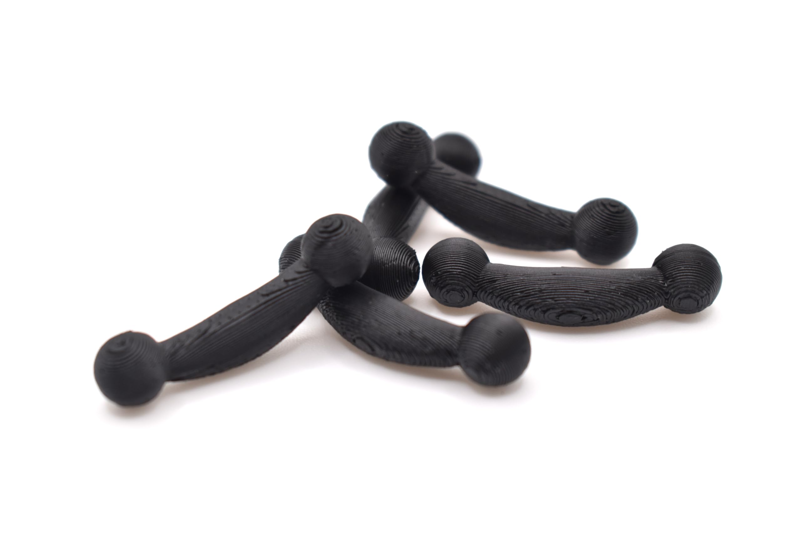 A picture of all five included Snark replacement arms in a pile.