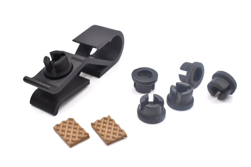 A 3d printed clip, compatible with Snark tuners. Shows all components including replacement sockets and attachable foam strips.